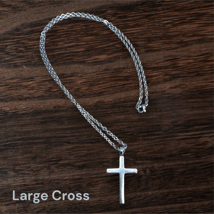 Large Classic Cross necklace arranged in a loop on wood