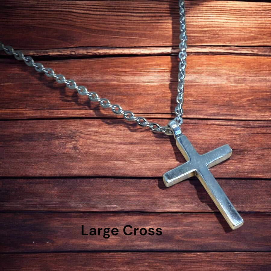 Large Classic Cross pendant and chain against wood