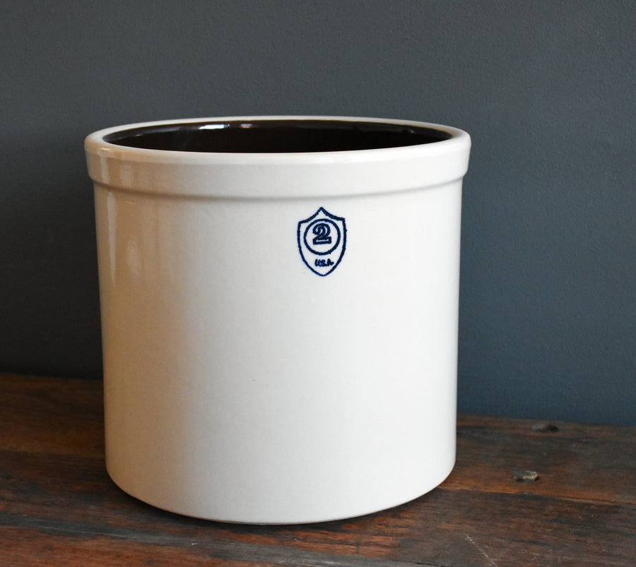 Bristol off-white 2-gallon stoneware preserving crock on a wood surface