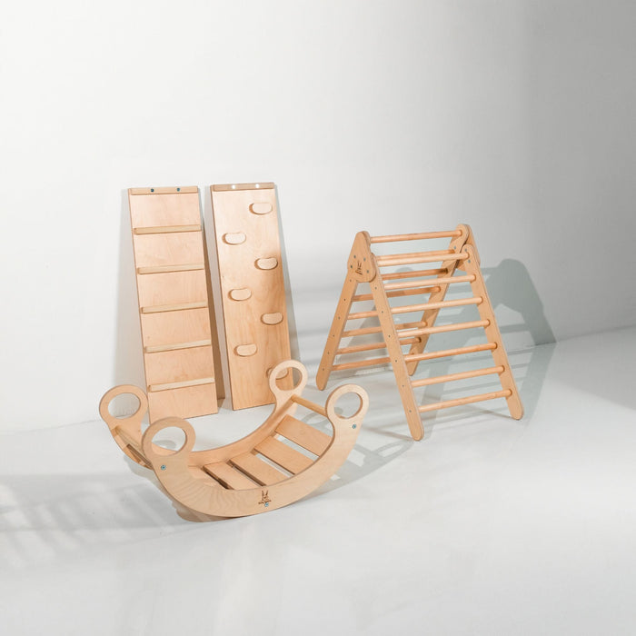 Child's adventure with a rocker climber arch