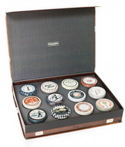 Vintage case of Bar Cart Snacks with a variety of tins containing classic salty snacks perfect for pairing with beverages.