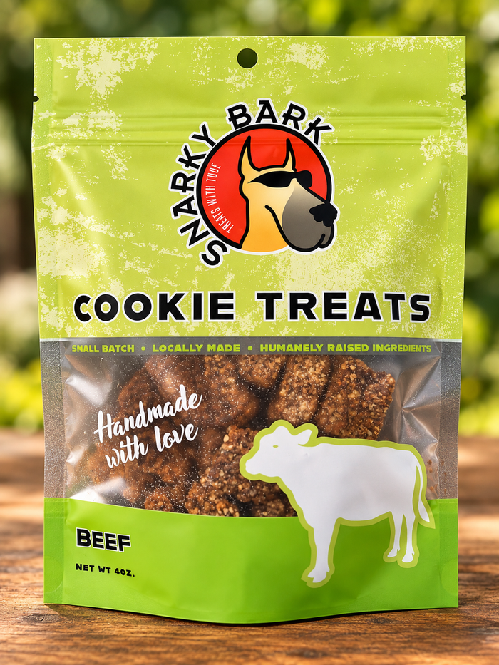Snarky Bark beef cookie treats in a green pouch with a cow silhouette