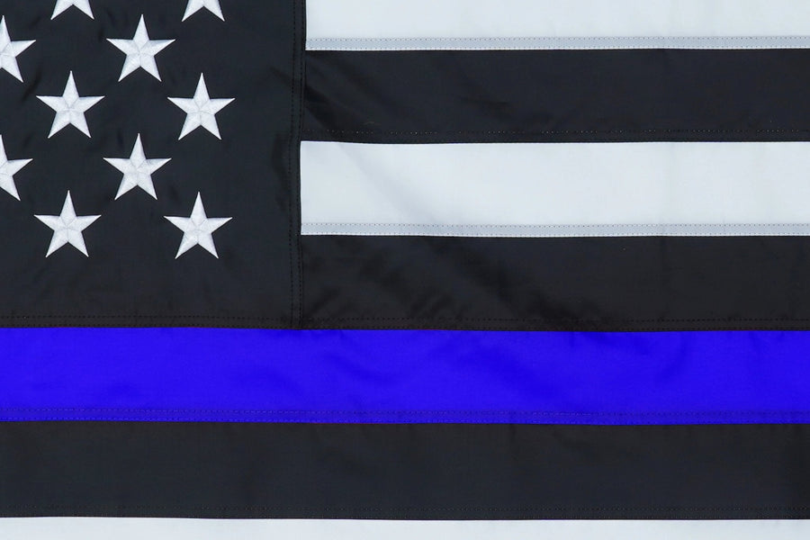 Thin Blue Line American Flag emblem and stitching in close-up