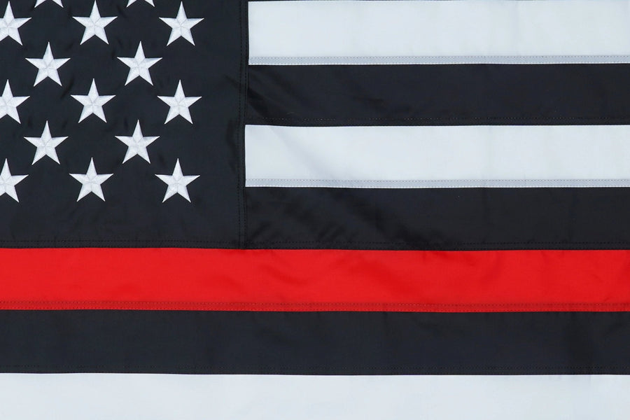 Thin Red Line American Flag emblem and stitching in close-up
