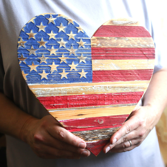 Pallet wood wall heart painted with an American flag design.
