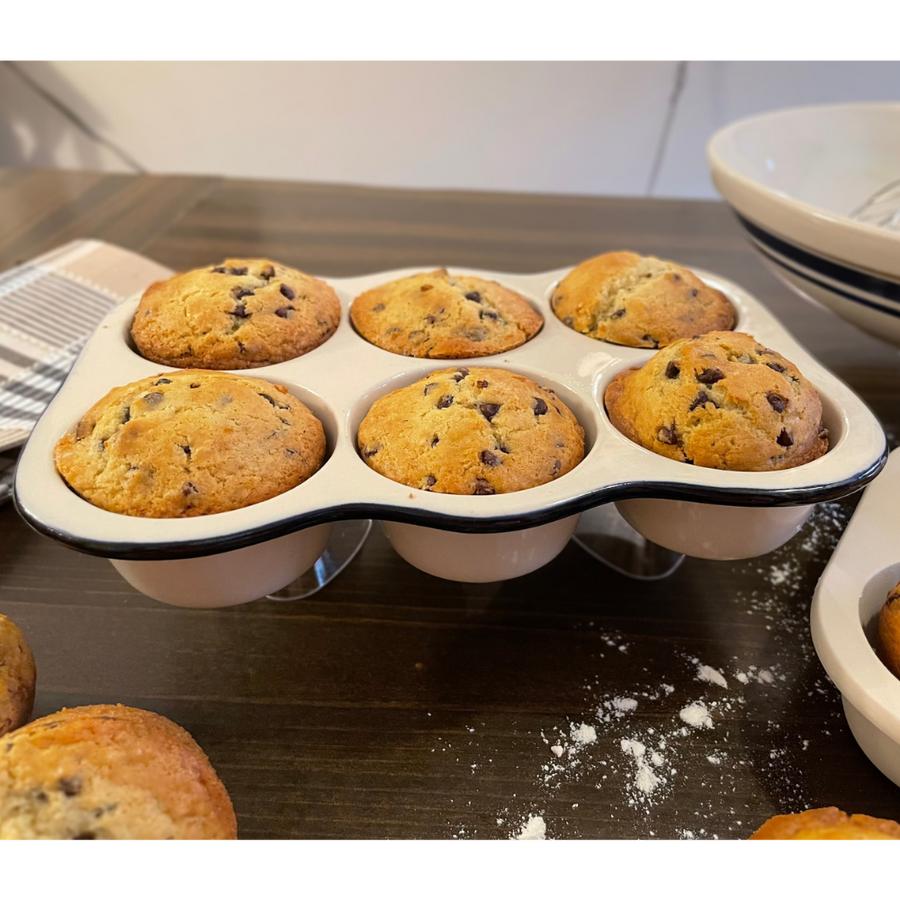 Six-cup Dominion stoneware muffin pan displayed with baked muffins