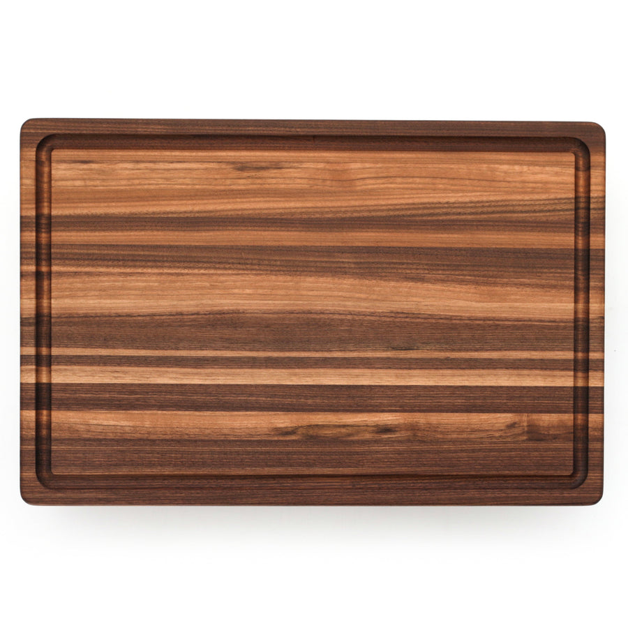 Overhead view of a walnut edge-grain board with a perimeter groove