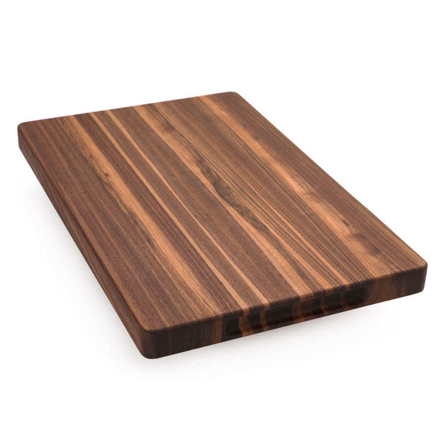 Walnut edge-grain cutting board showing a plain striped surface