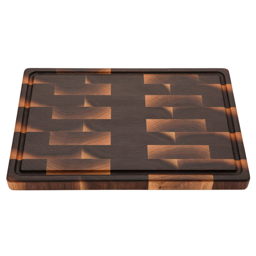 Walnut end-grain board with a perimeter juice groove, overhead view