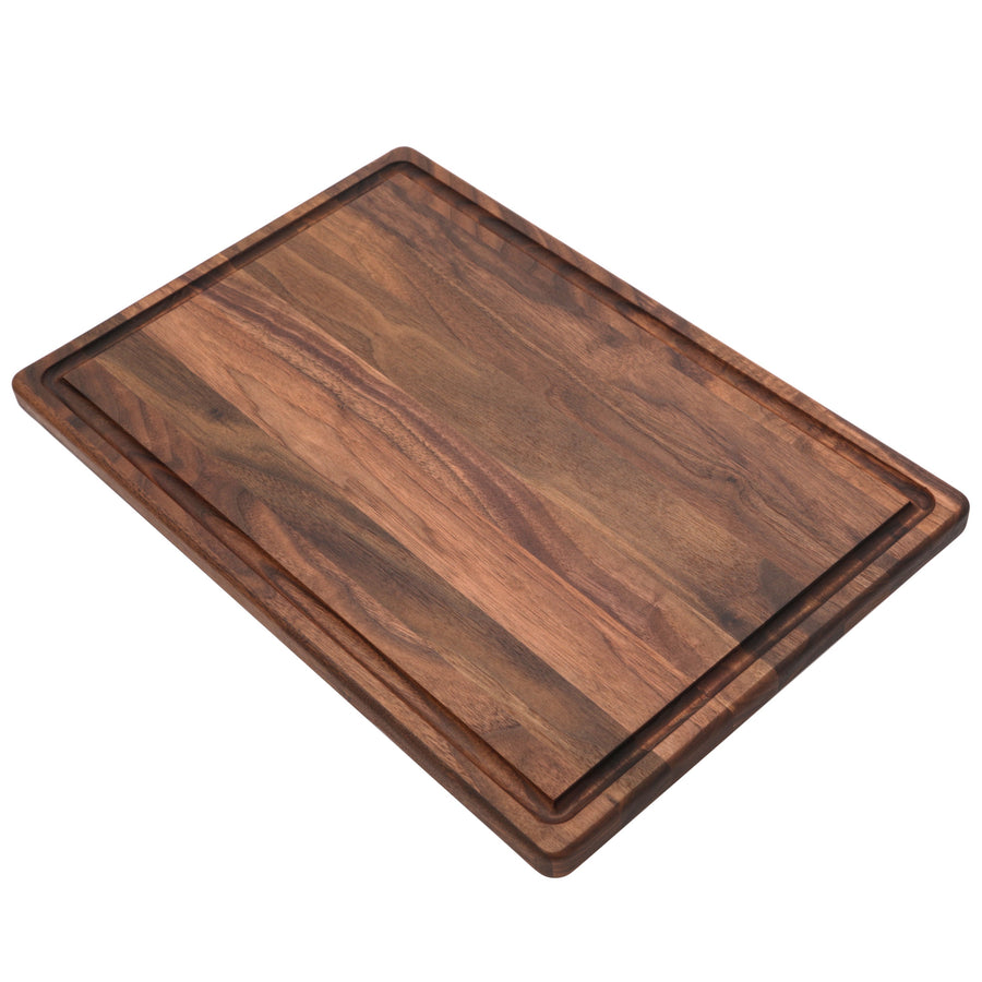 Walnut cutting board with a juice groove, angled view