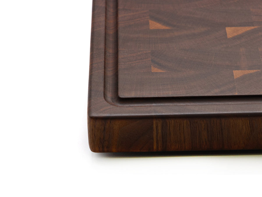 Corner detail showing the thickness and juice groove of a walnut end-grain board