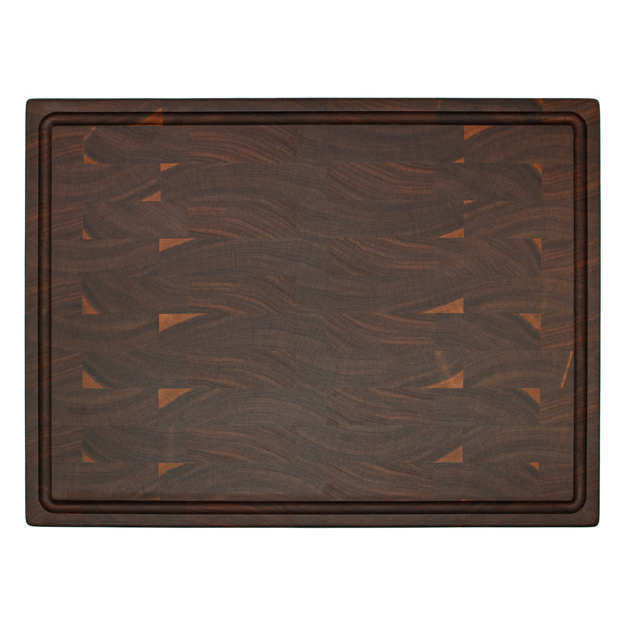 Overhead view of a walnut end-grain board with a perimeter groove