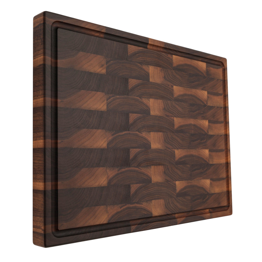 Walnut end-grain butcher block standing upright to show its thick profile