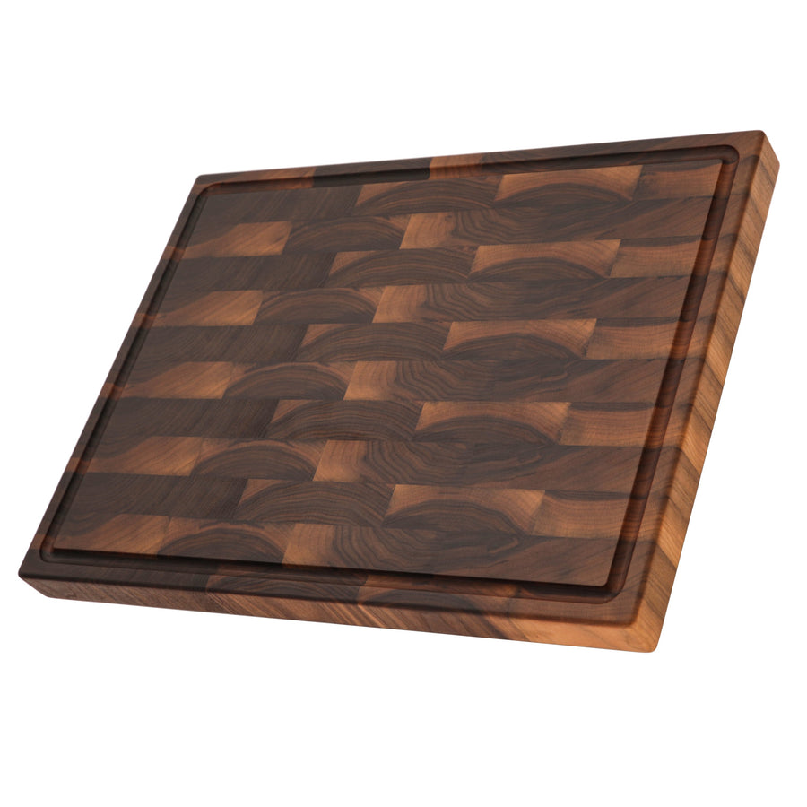Walnut end-grain board with a juice groove, angled view