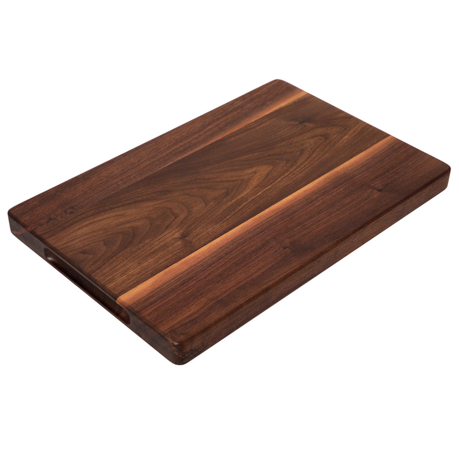 Thick walnut cutting board photographed at an angle
