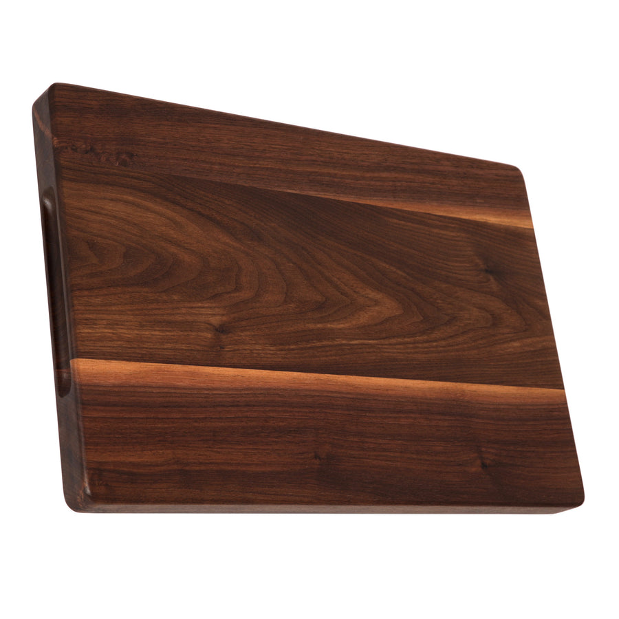 Walnut cutting board showing its thick edge and plain surface
