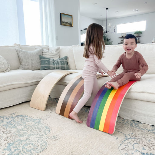 Child balancing on a wobble board