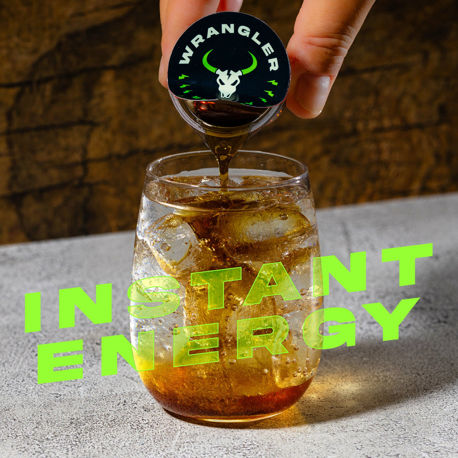Hand pouring Wrangler energy concentrate over ice