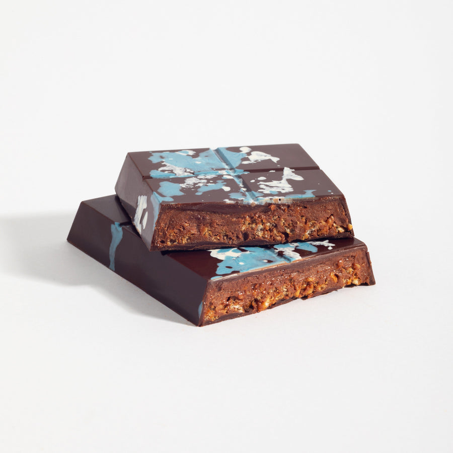 Almond Praline Crunch Dark Chocolate Bars cut open to show its layered filling