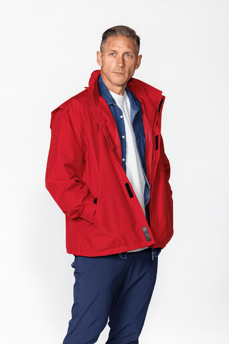 Blitz Waterproof Jacket: model wearing red shell.