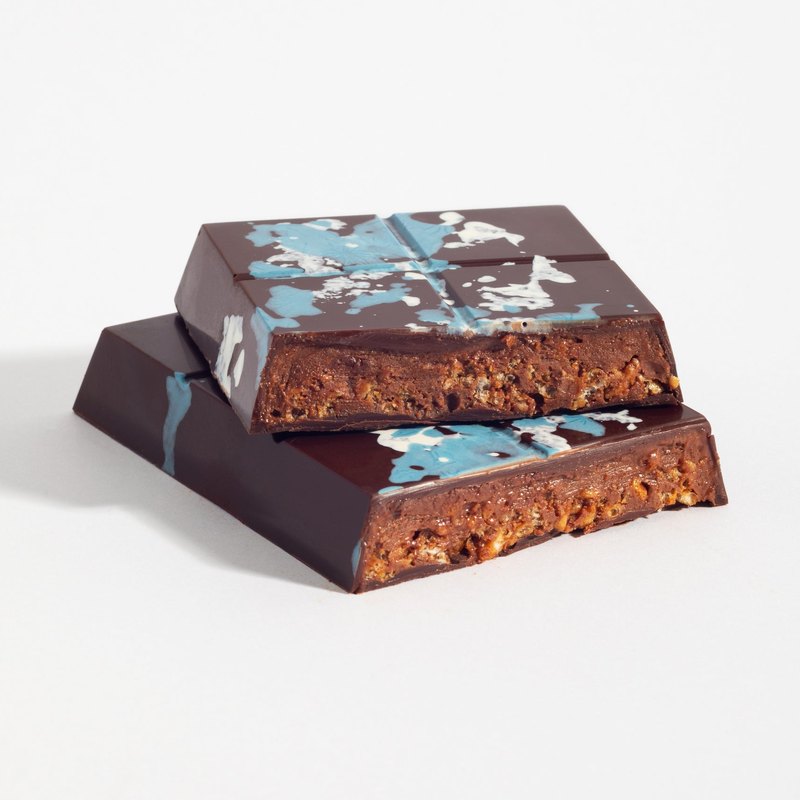 Almond Praline Crunch bar cut open to show the filling