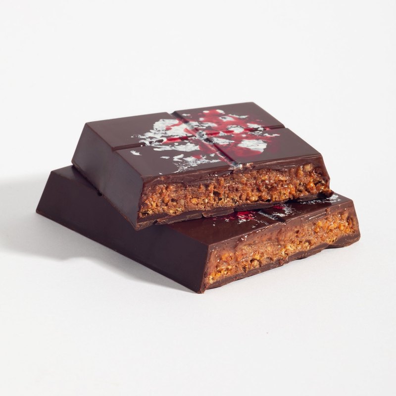 Pecan Praline Crunch bar cut open to show the filling