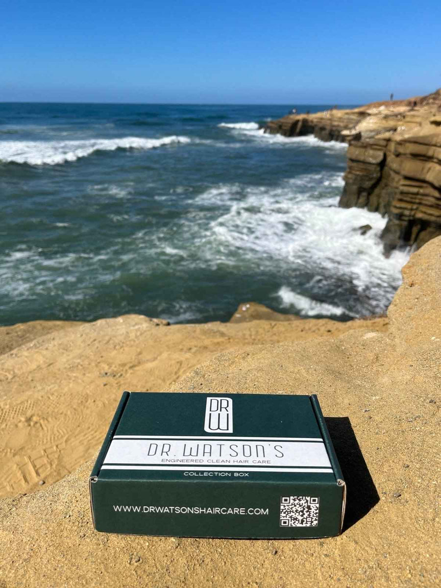 Closed Dr. Watson's Discovery Set box by the ocean