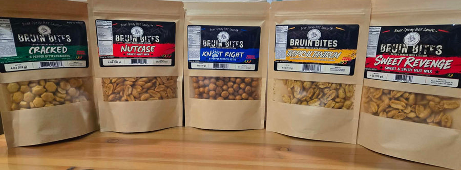 Five Bruin Bites snack pouches showing Cracked, NutCase, Knot Right, Tropical Tantrum and Sweet Revenge