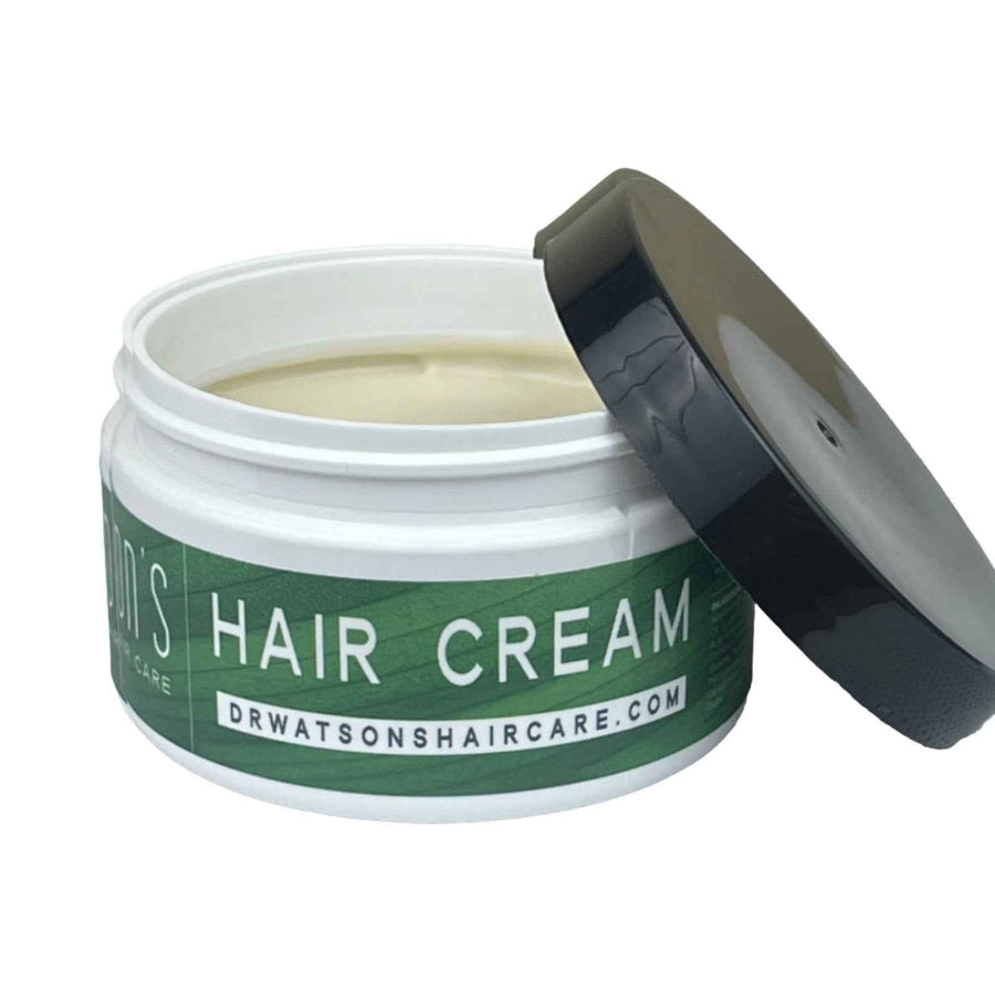 Open jar of Dr. Watson's hair styling cream with black lid