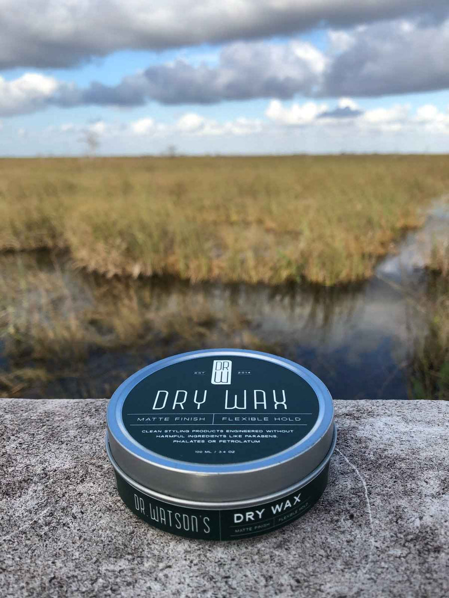 Dry Wax jar beside a coastal marsh