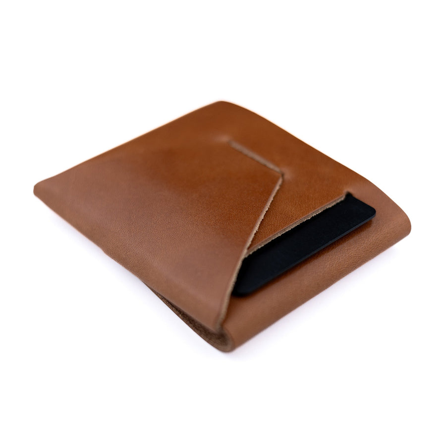 Brown Franklin 2 leather wallet, angled rear view with a card in the pocket