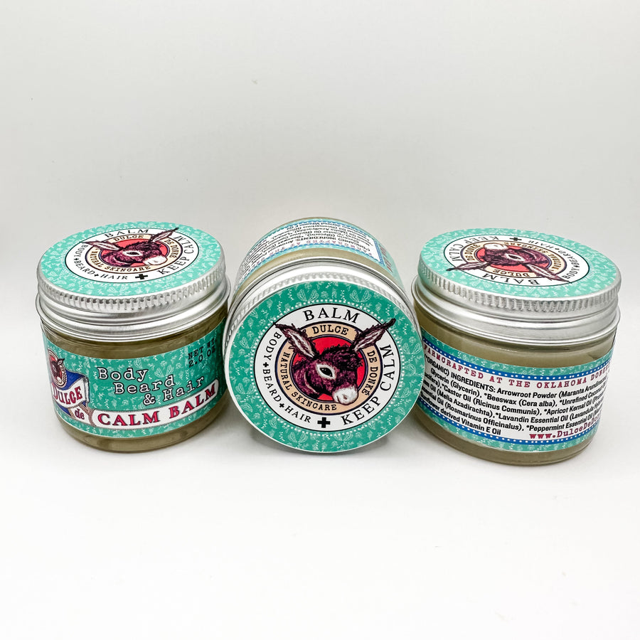 Three Calm Balm jars showing front, lid, and ingredient-label views