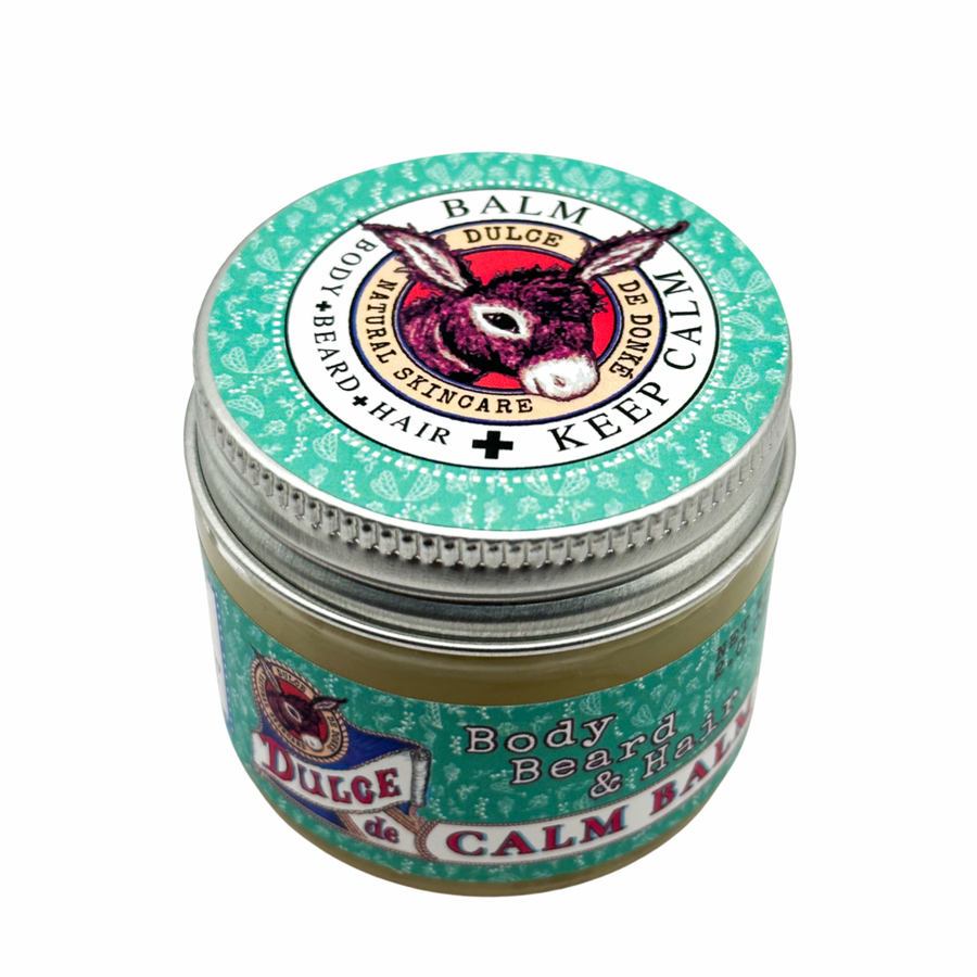 Closed Calm Balm jar with a green label and silver lid