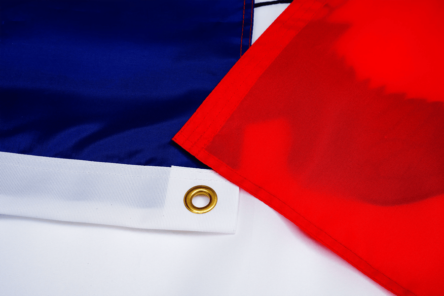 Iowa State Flag fabric, white heading, and brass-tone grommet
