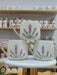 A trio of handcrafted ceramic mugs adorned with delicate lavender sprigs, each topped with a touch of gold on the handle, perfect for bringing a hint of nature’s calm to your coffee ritual.