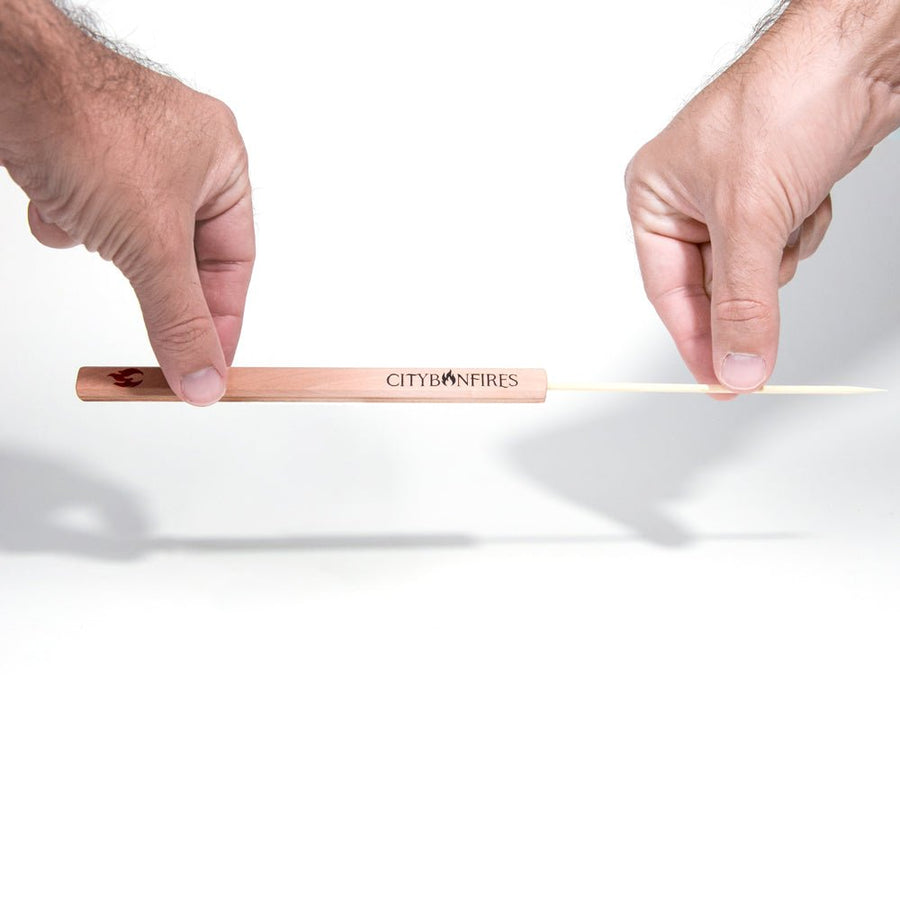 Lid Buddy wooden handle shown between two hands