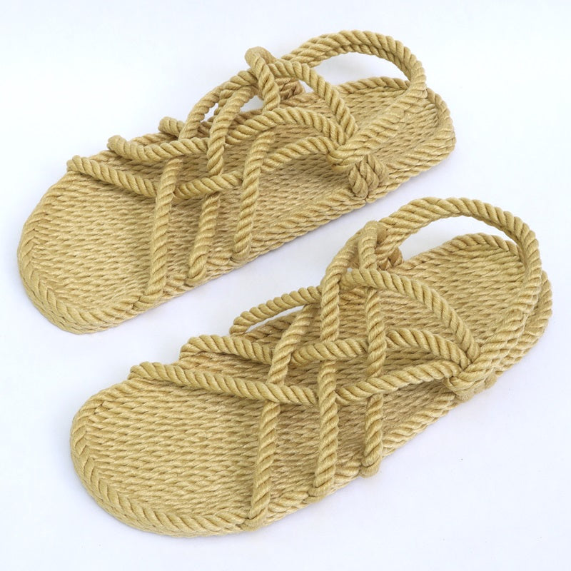 Pair of beige Utopian rope sandals showing woven soles and crisscross straps