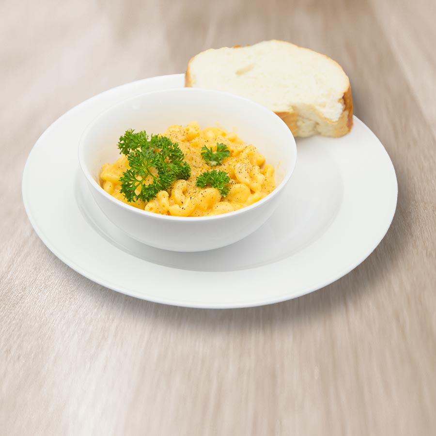 Prepared macaroni and cheese with broccoli and bread, serving suggestion