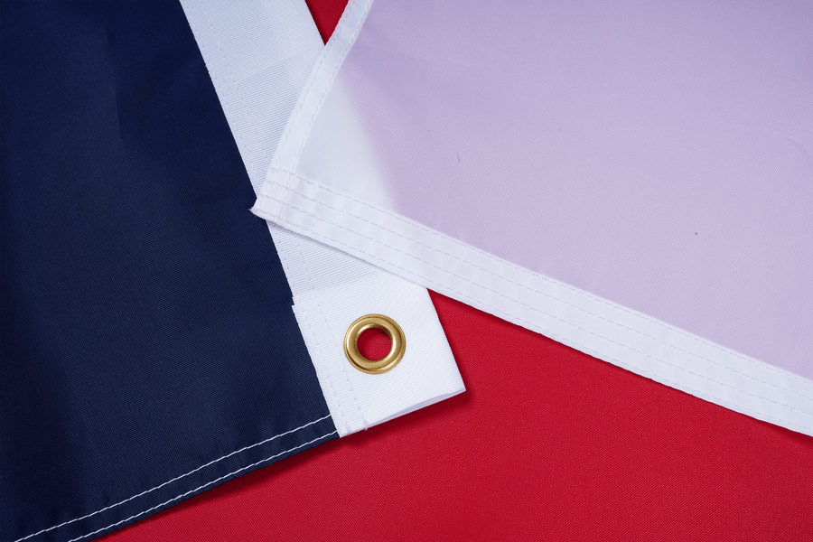 North Carolina State Flag fabric, white heading, and brass-tone grommet