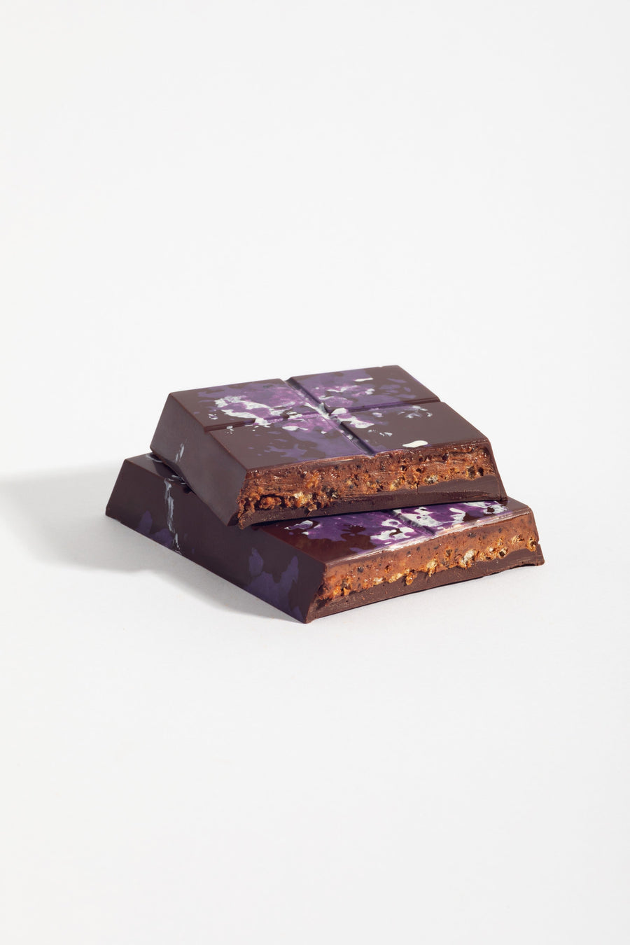 Peanut Praline Crunch Dark Chocolate Bars cut open to show its layered filling