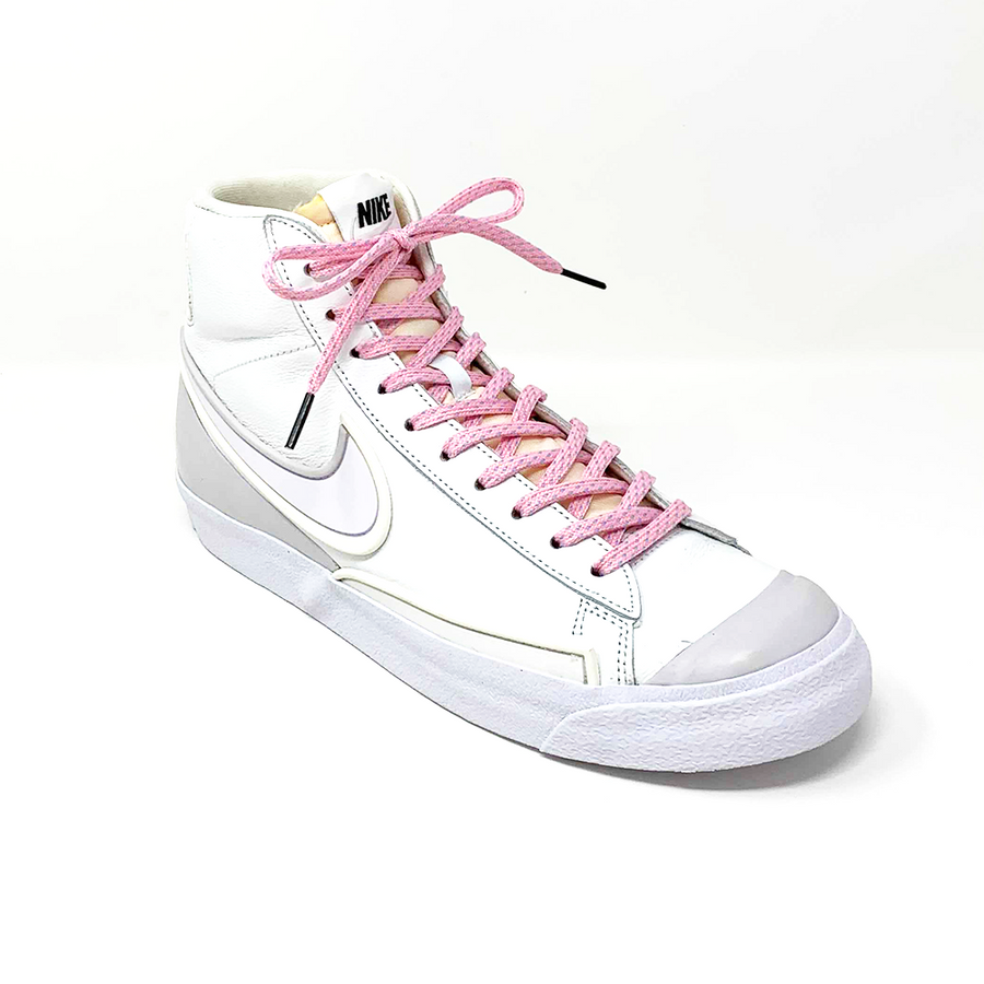 Pink & Light Blue ticked flat shoelaces laced into a white high-top sneaker