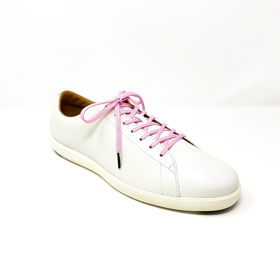 Pink & Light Blue ticked flat shoelaces laced into a cream low-top sneaker