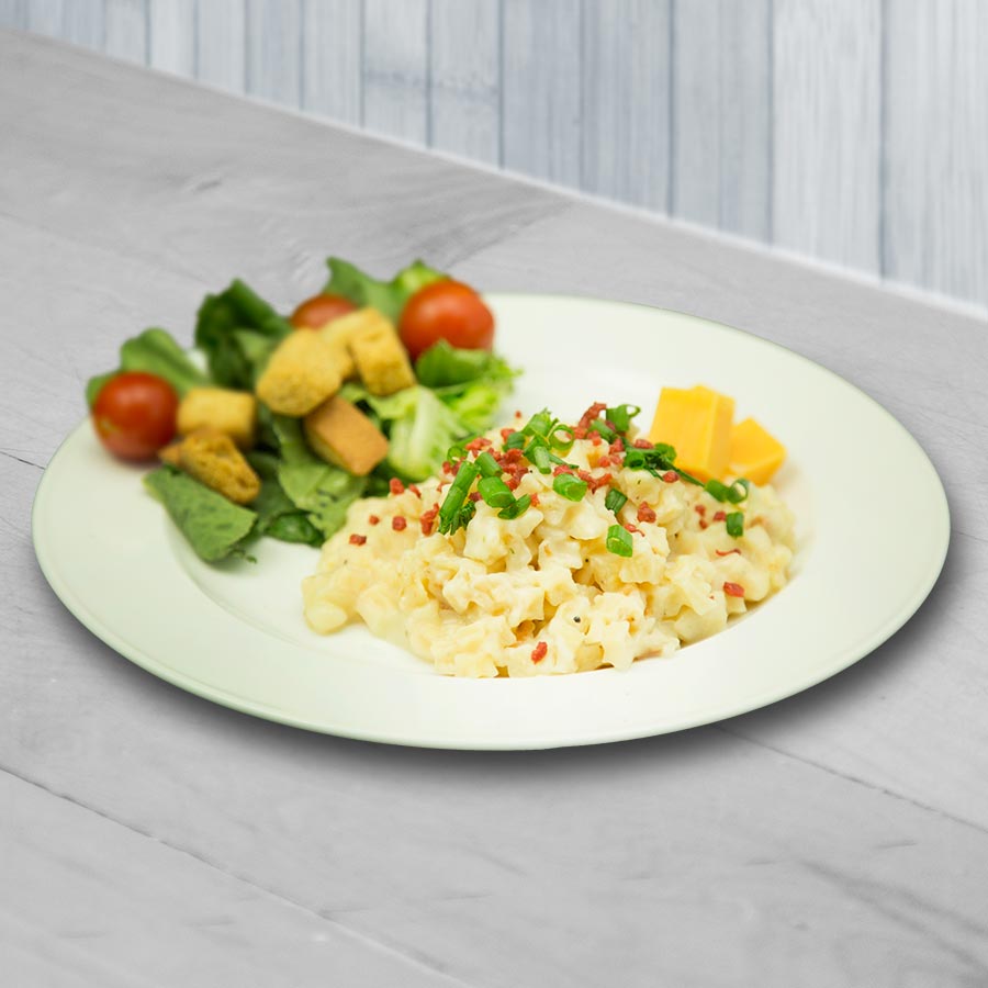 Prepared potato casserole with vegetables, serving suggestion