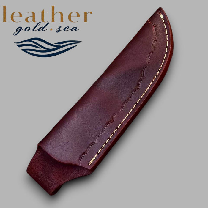 Plain curved face of brown leather knife sheath