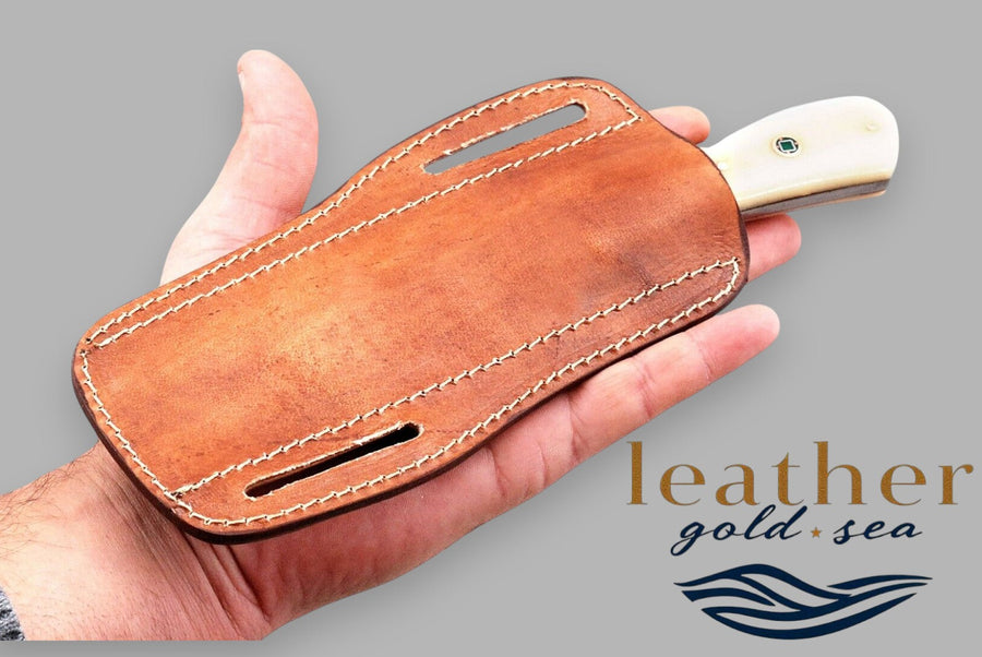 Reverse of brown Western sheath with demonstration knife
