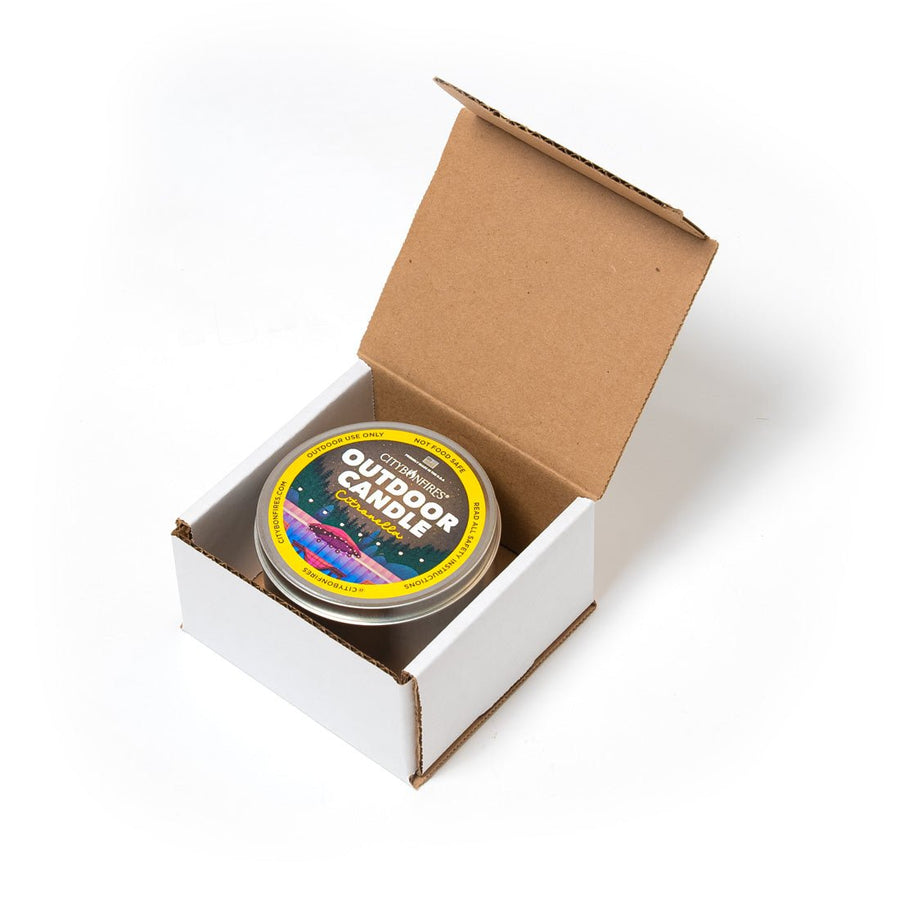 Citronella outdoor candle inside an open box