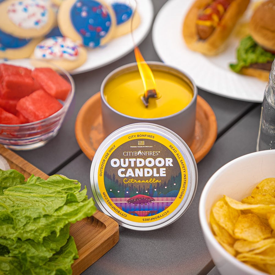 Citronella outdoor candle on a cookout table
