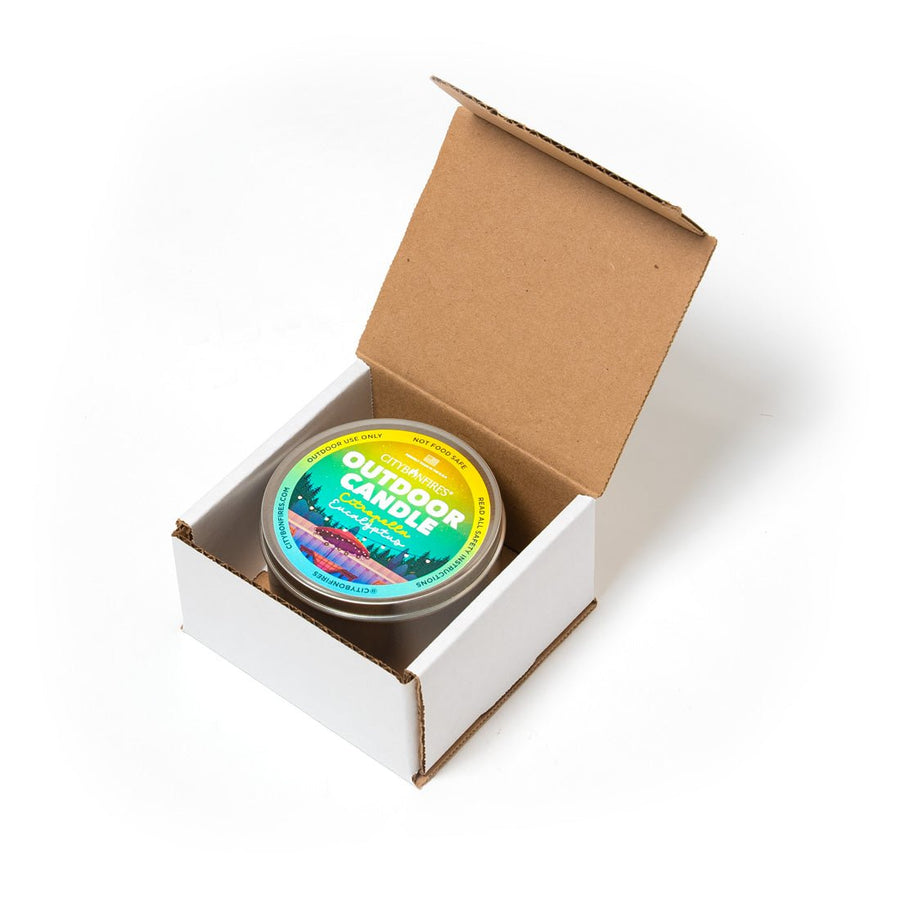 Citronella and eucalyptus candle inside an open box