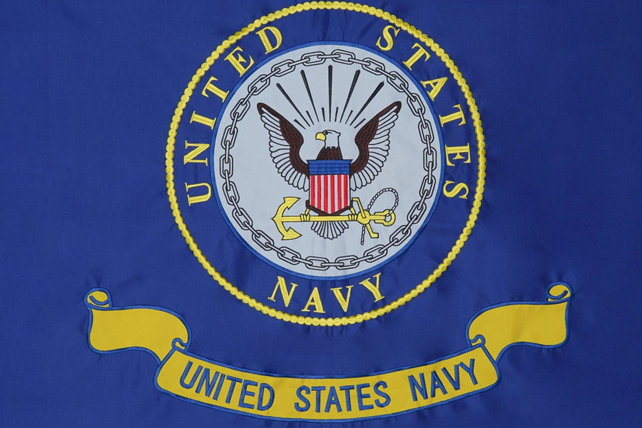 U.S. Navy flag with circular Navy seal emblem emblem and stitching in close-up