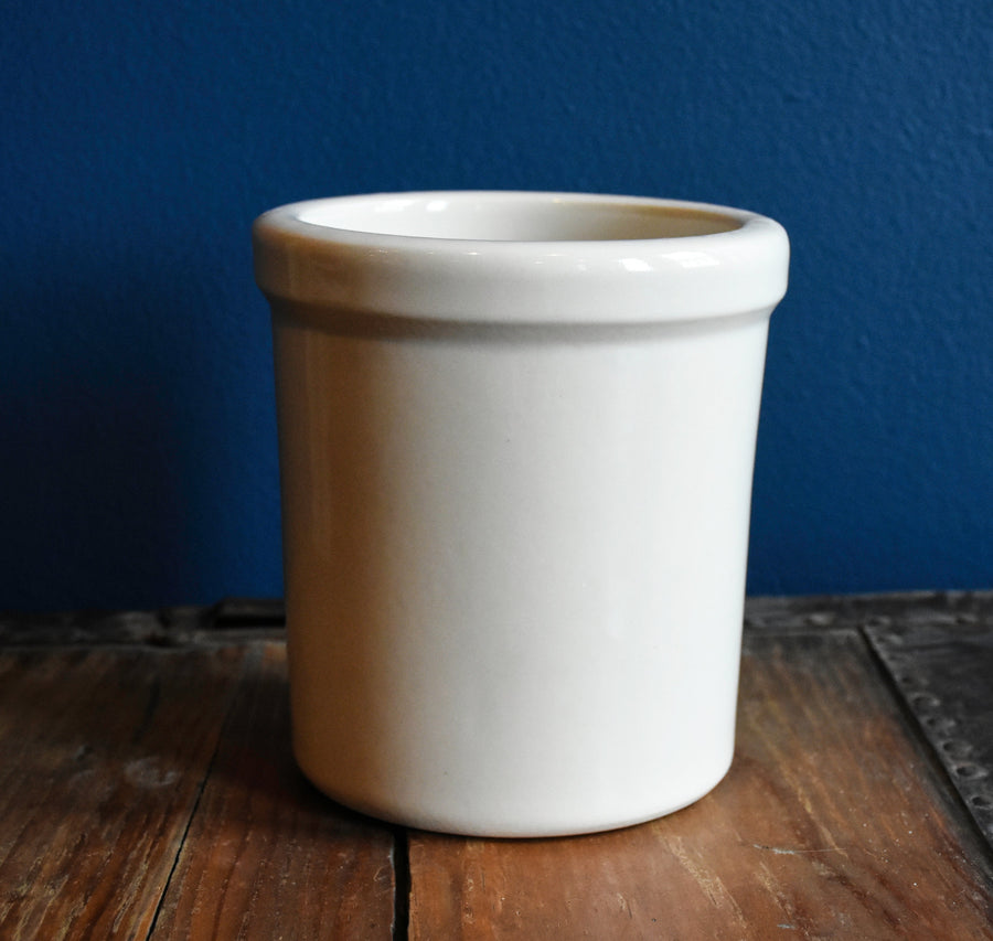Bristol off-white stoneware utility crock - 1 quart tall on a wood surface